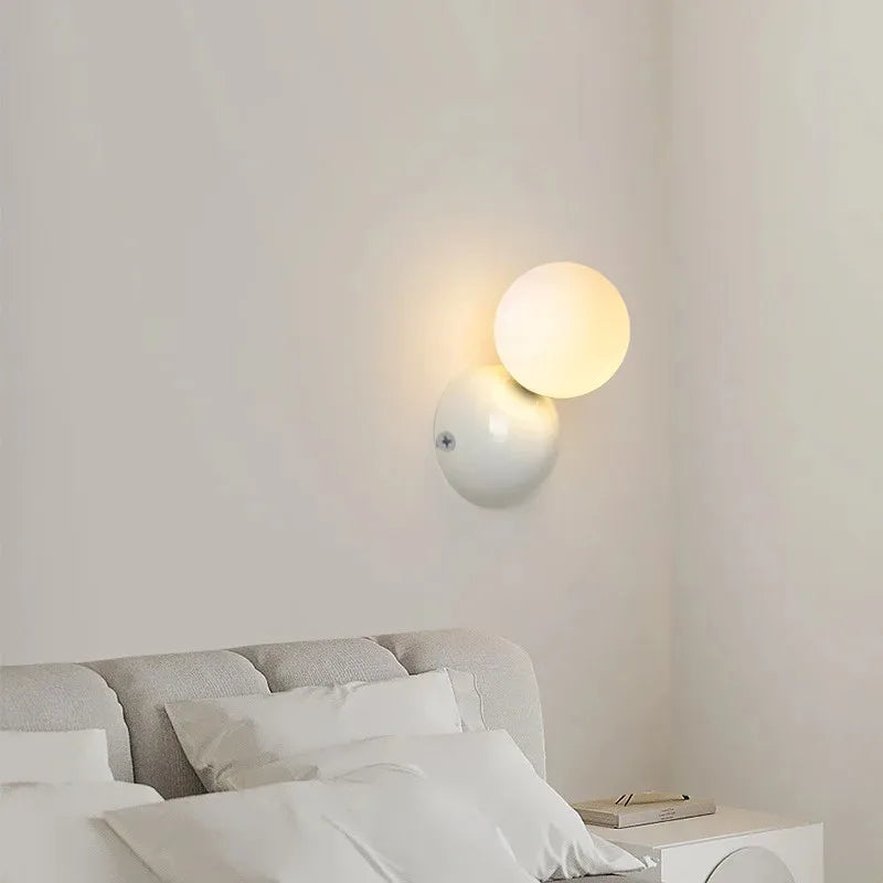 Aurea Wall Sconce In Cream Finish With Frosted Glass Ball Shade