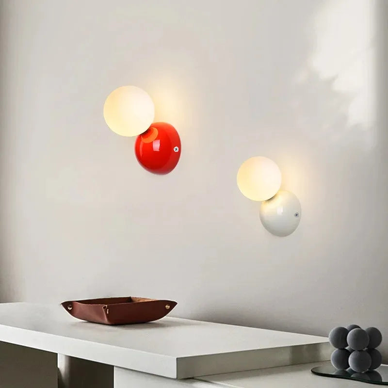 Aurea Wall Sconce In Cream Finish With Frosted Glass Ball Shade
